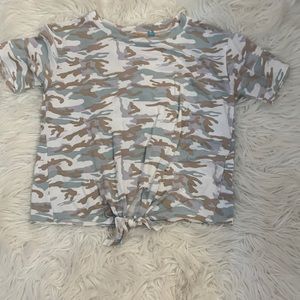 Camouflage tie shirt with writing on the back.